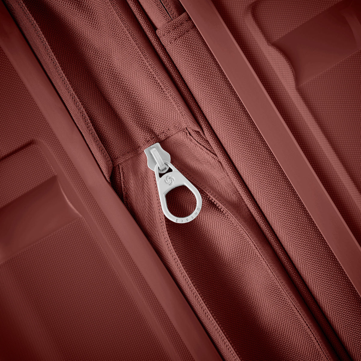Samsonite Outline Pro Spinner Medium in the color Mars Red.