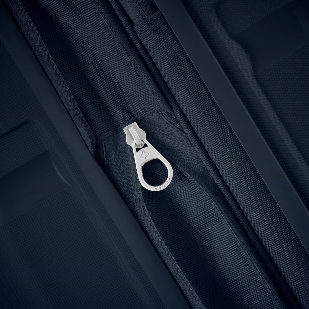 Samsonite Outline Pro Spinner Large in the color Midnight Blue.