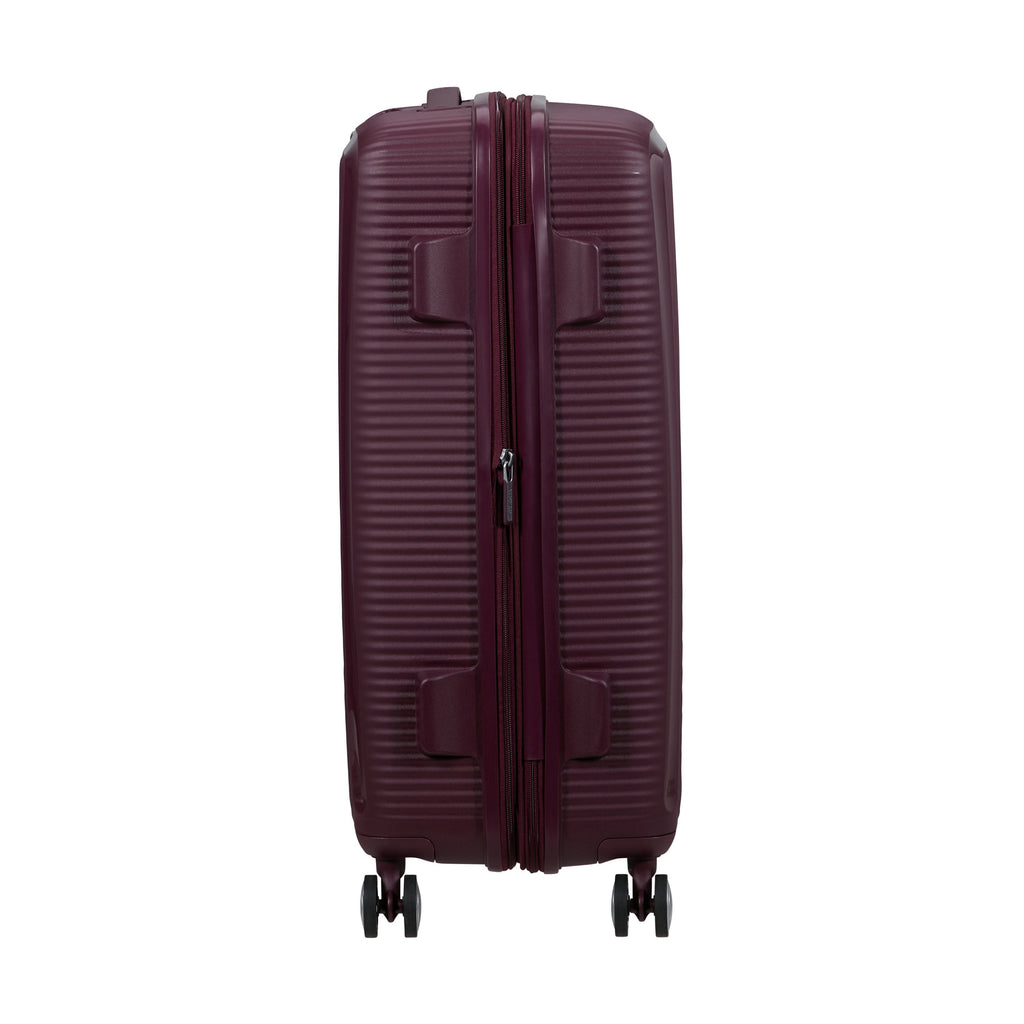 American Tourister Curio Spinner Medium in the color Wild Cherry.