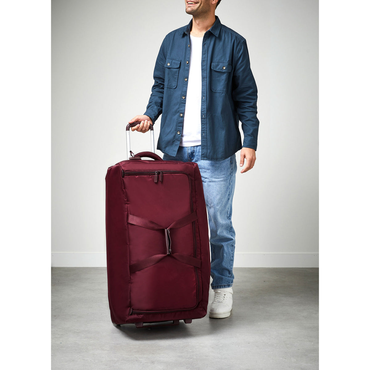 Lipault Foldable Plume Wheeled Duffle (78/29) in the color Bordeaux.