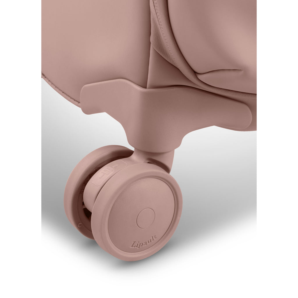 Lipault Lost In Berlin Cabin Spinner 2.0 in the color Rose Quartz.
