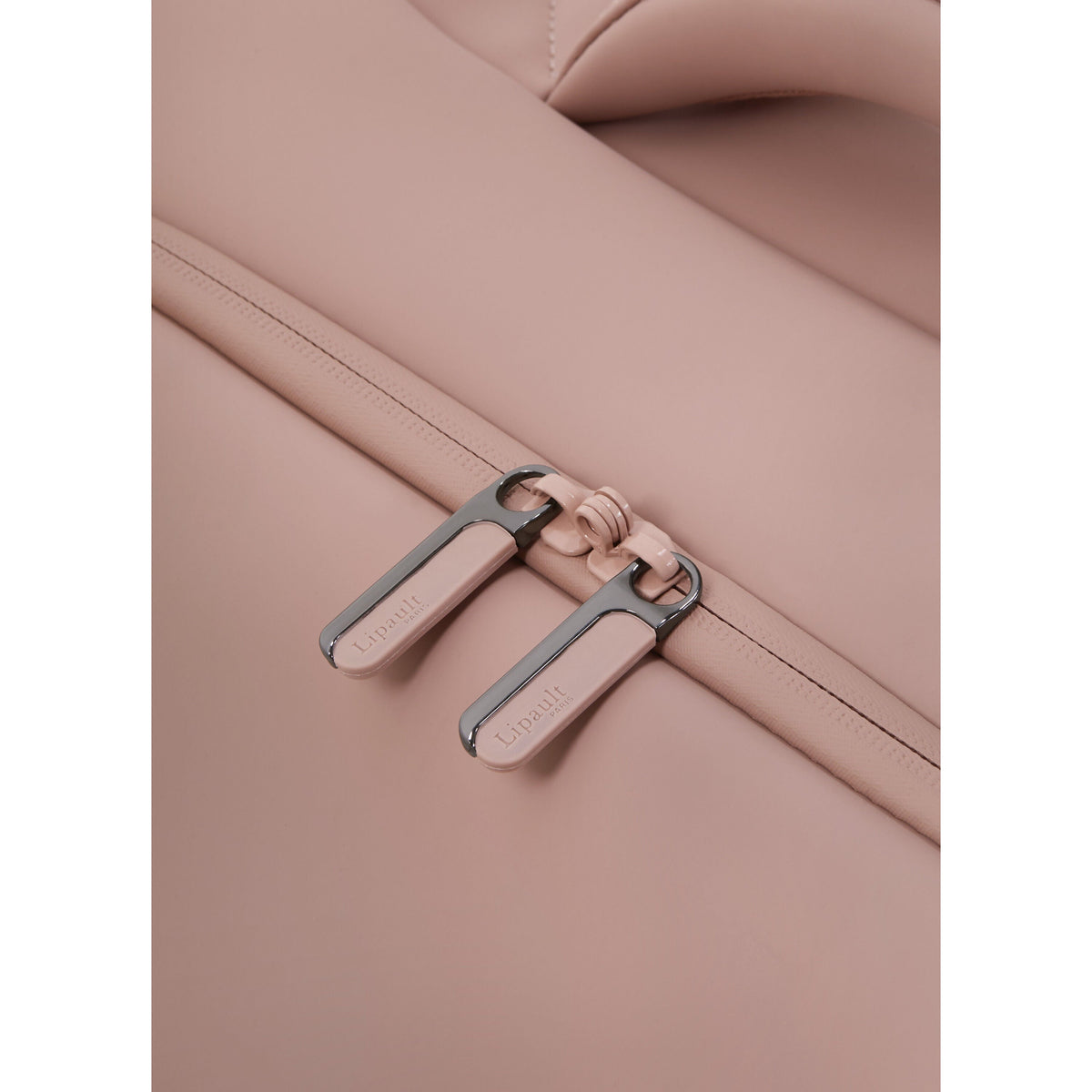 Lipault Lost In Berlin Cabin Spinner 2.0 in the color Rose Quartz.