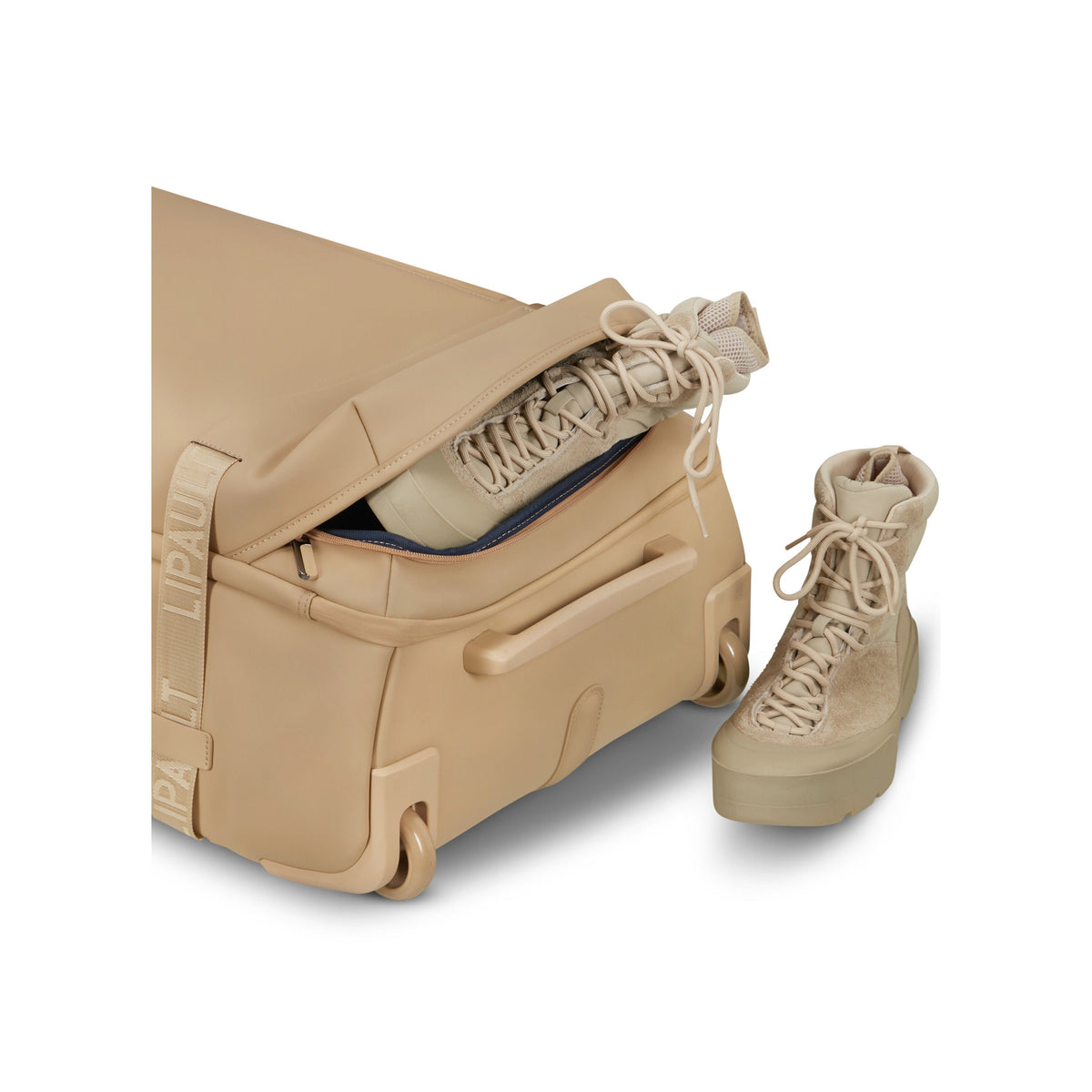 Lipault LOST IN BERLIN Wheeled Duffle in the color Sandstone.