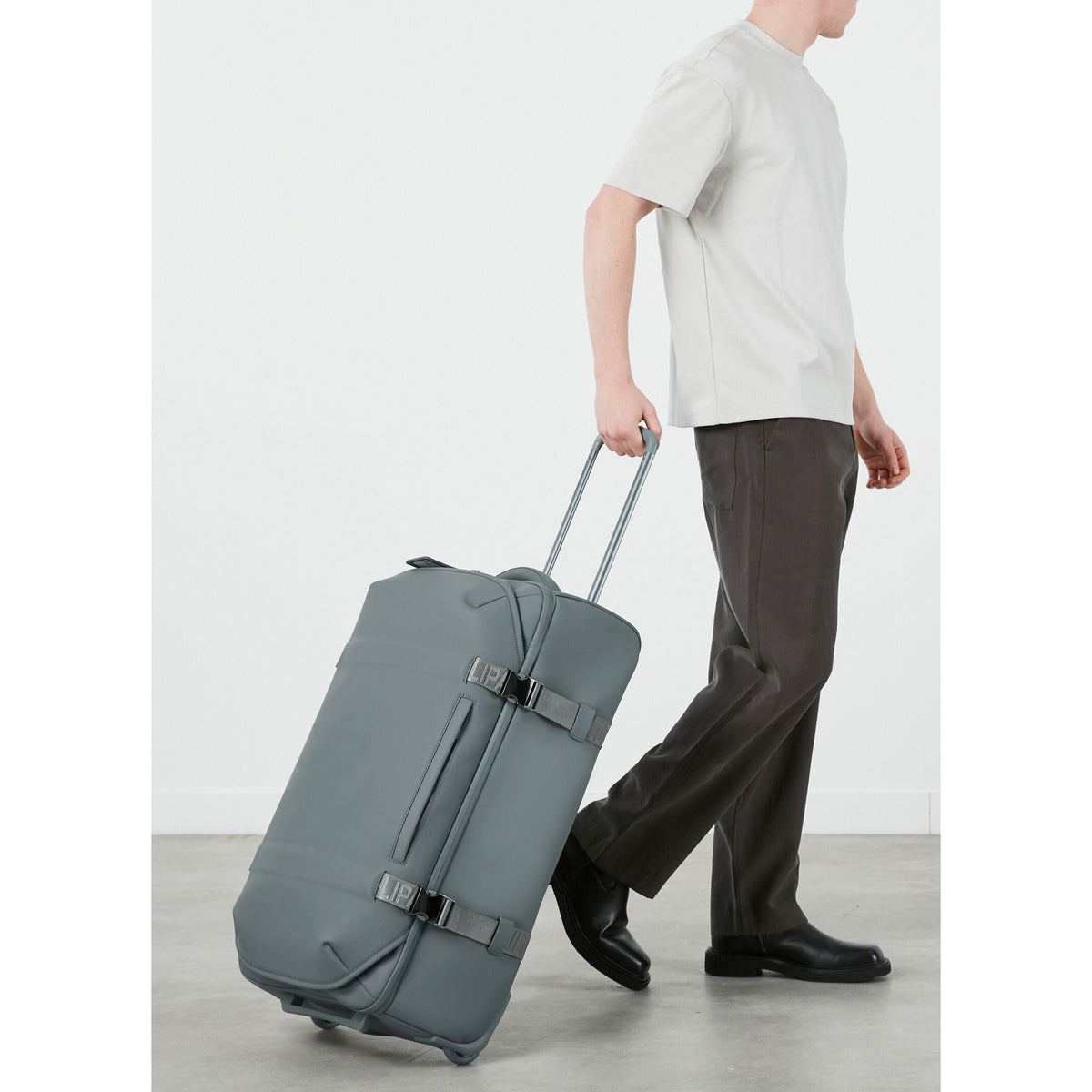 Lipault LOST IN BERLIN Wheeled Duffle in the color Cement Storm.