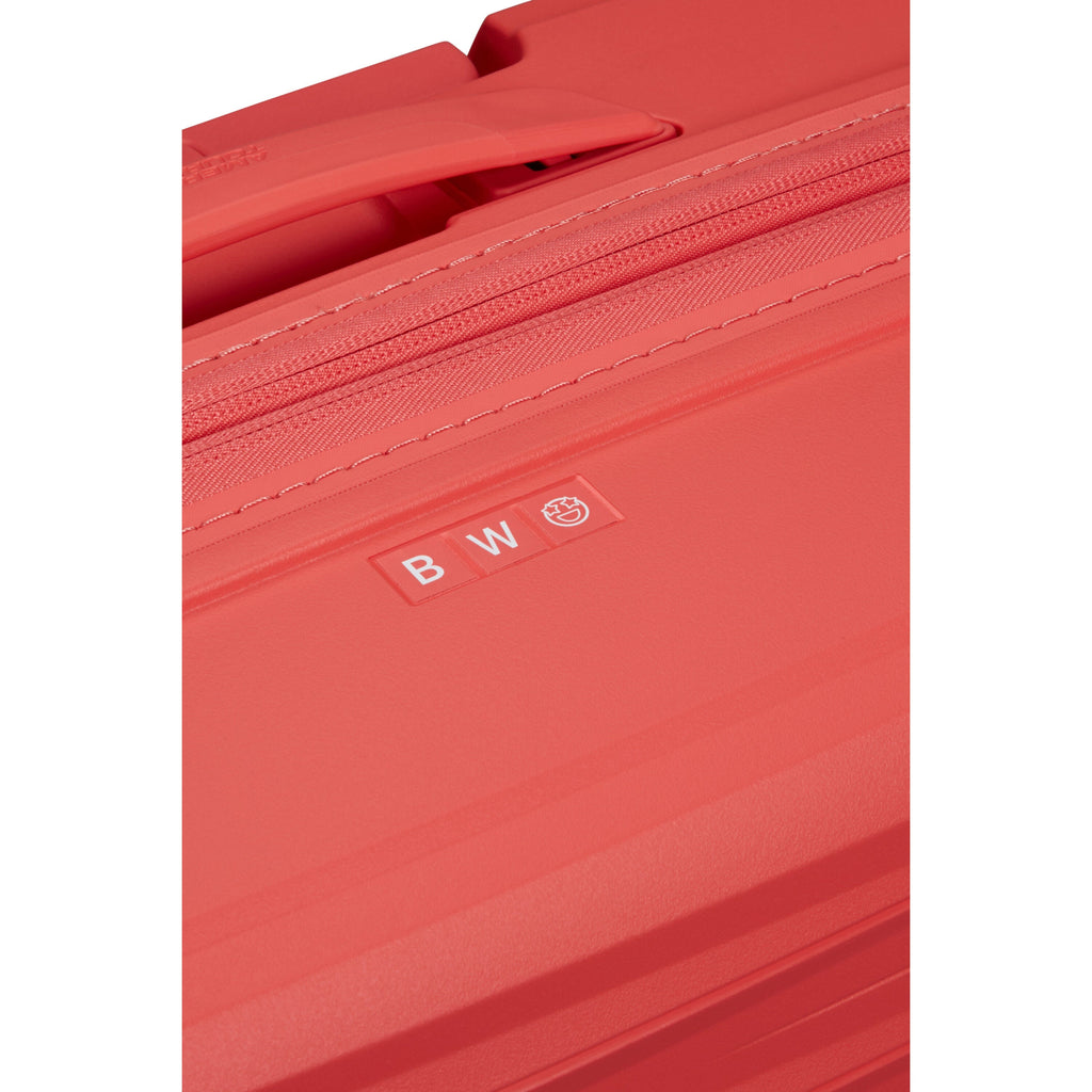 American Tourister FastForward Spinner Carry-On™ in the color Sunset Coral.