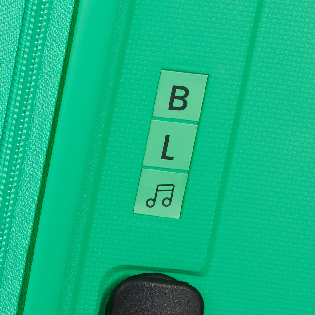 American Tourister Rejoy Spinner Large in the color Jade Green.