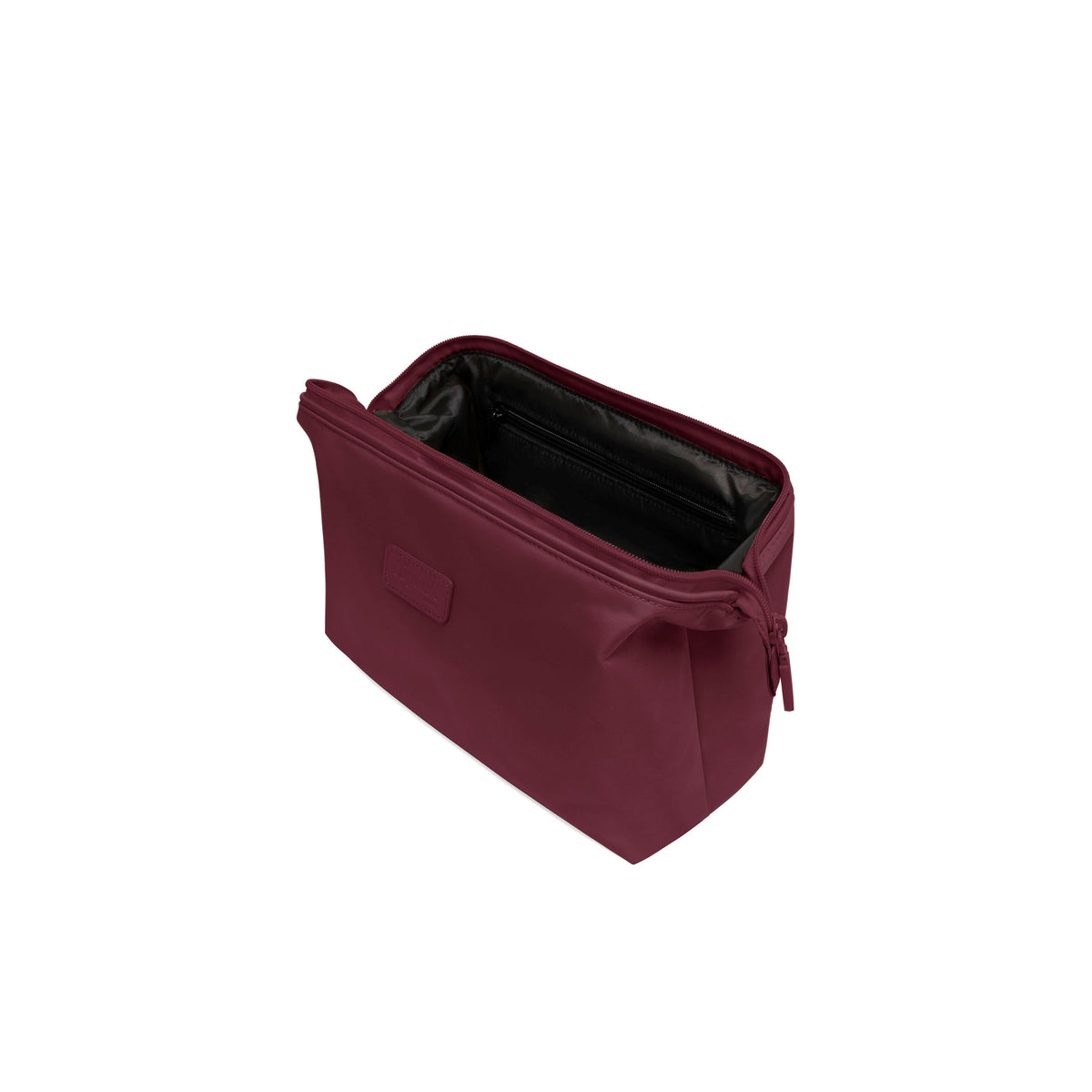 Lipault Plume Accessories Toiletry Kit in the color Bordeaux.